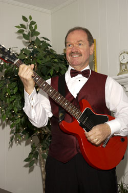 Will picks the guitar at wedding reception.jpg